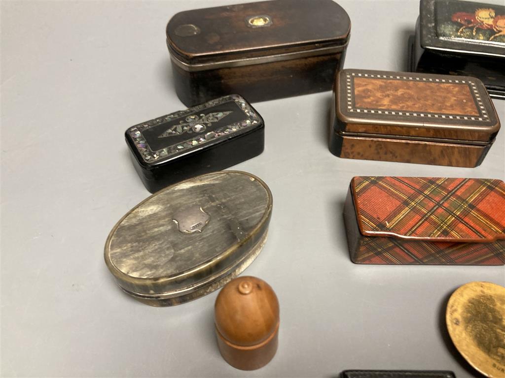 A collection of snuff boxes, mostly 19th century, including horn, tartan, mauchline, black papier mache and other treen